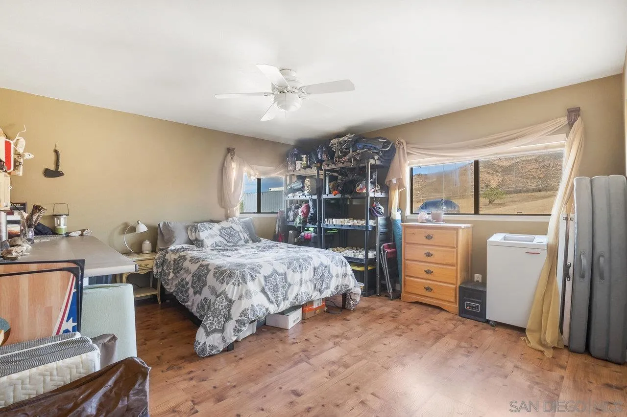 18995 Highway 94 Dulzura, CA 91917 - Photo 27 of 55 a bed room with a bed and cabinet