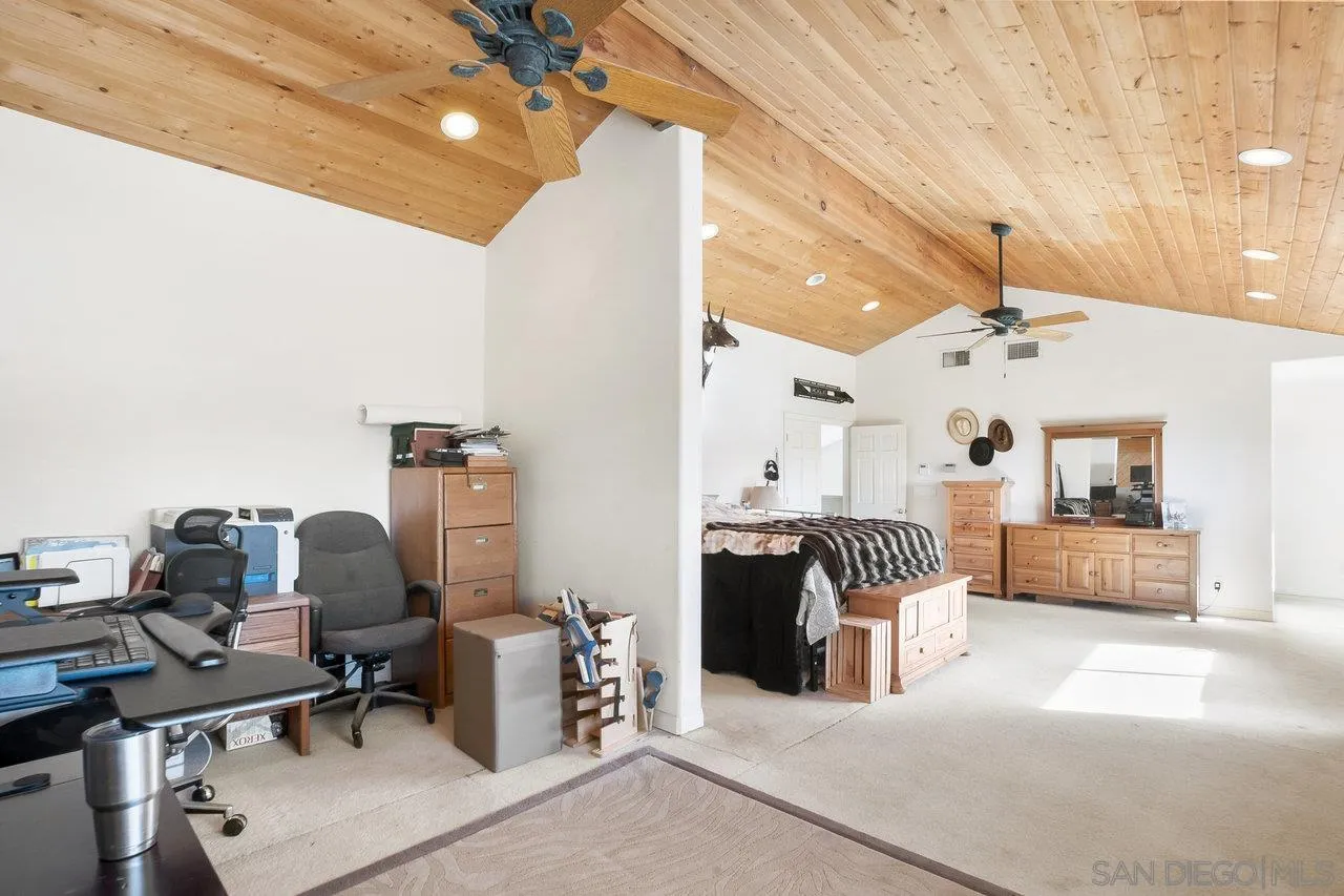 18995 Highway 94 Dulzura, CA 91917 - Photo 31 of 55 a living room with furniture and a chandelier