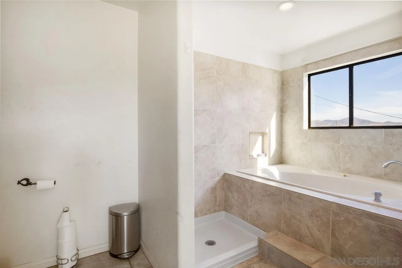 18995 Highway 94 Dulzura, CA 91917 - Photo 33 of 55 a bathroom with a bathtub and a shower