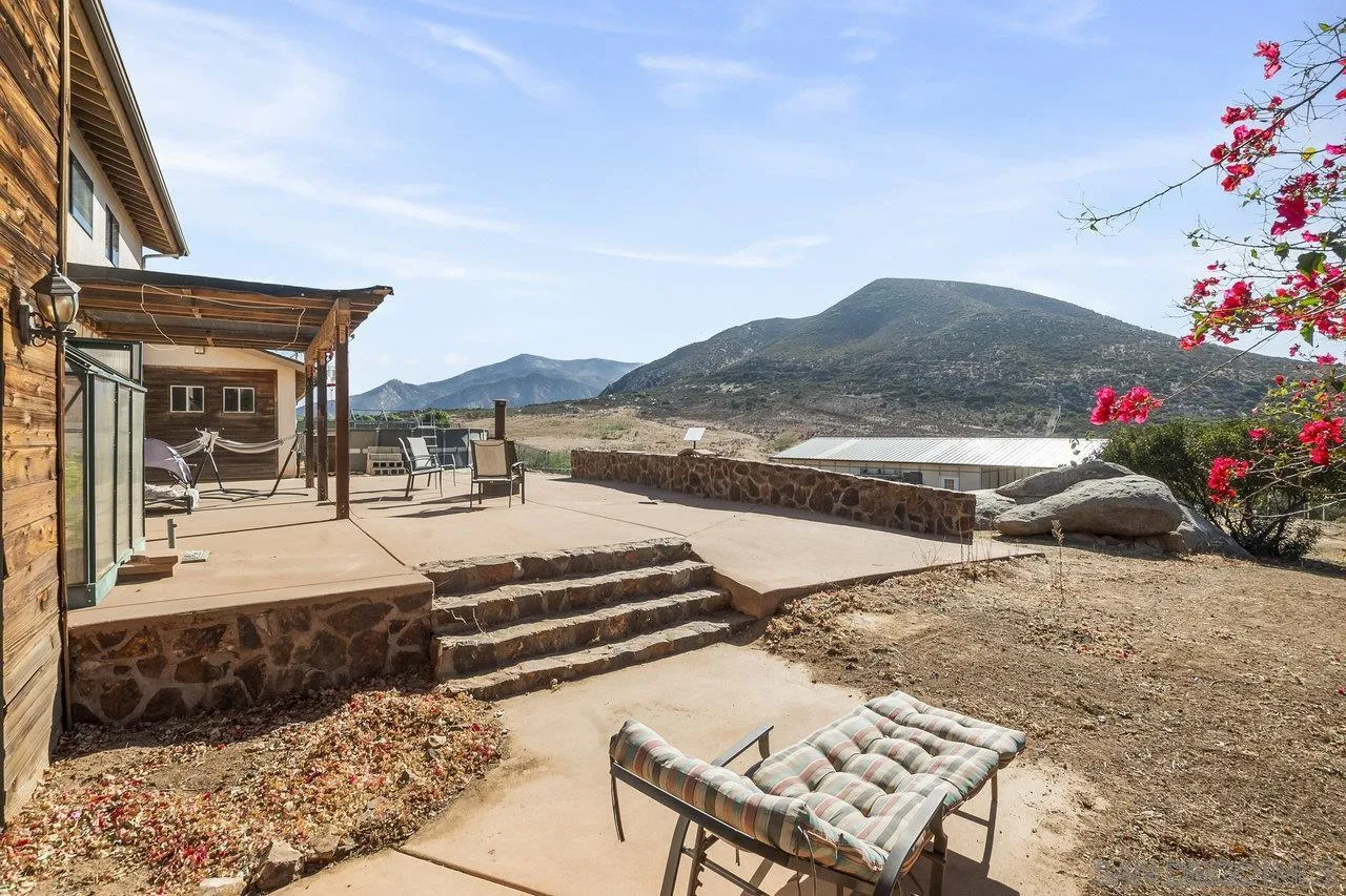 18995 Highway 94 Dulzura, CA 91917 - Photo 37 of 55 a view of a patio with couches table and chairs and potted plants