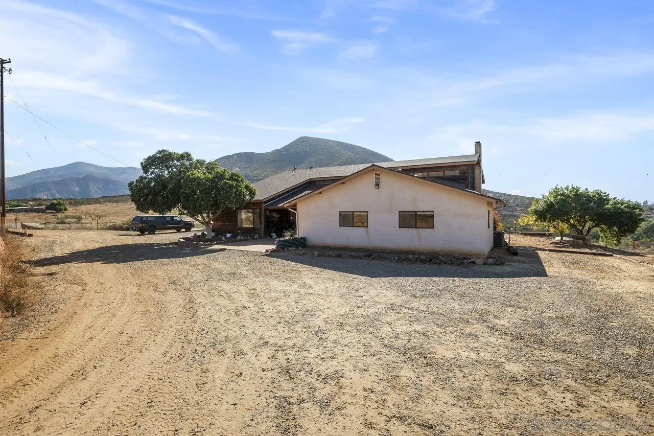 18995 Highway 94 Dulzura, CA 91917 - Photo 5 of 55 a view of a house with a yard