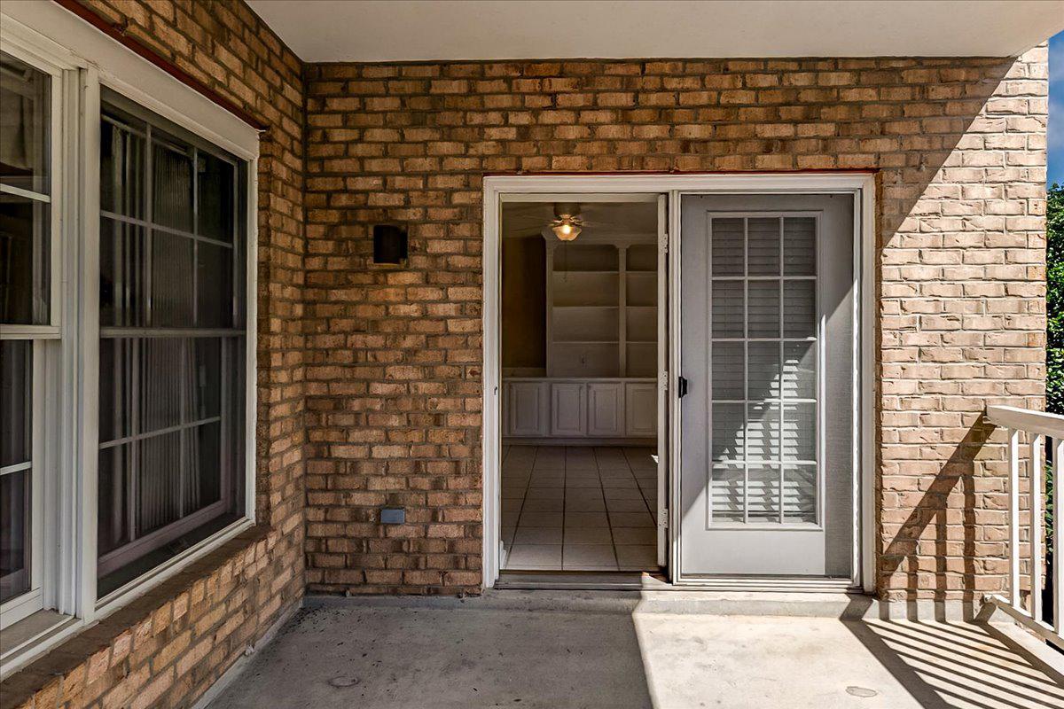 12330 Rosslare Ridge Road, Unit 406 Lutherville-Timonium, MD 21093 - Photo 32 of 37 Inviting entryway to balcony with brick charm.
