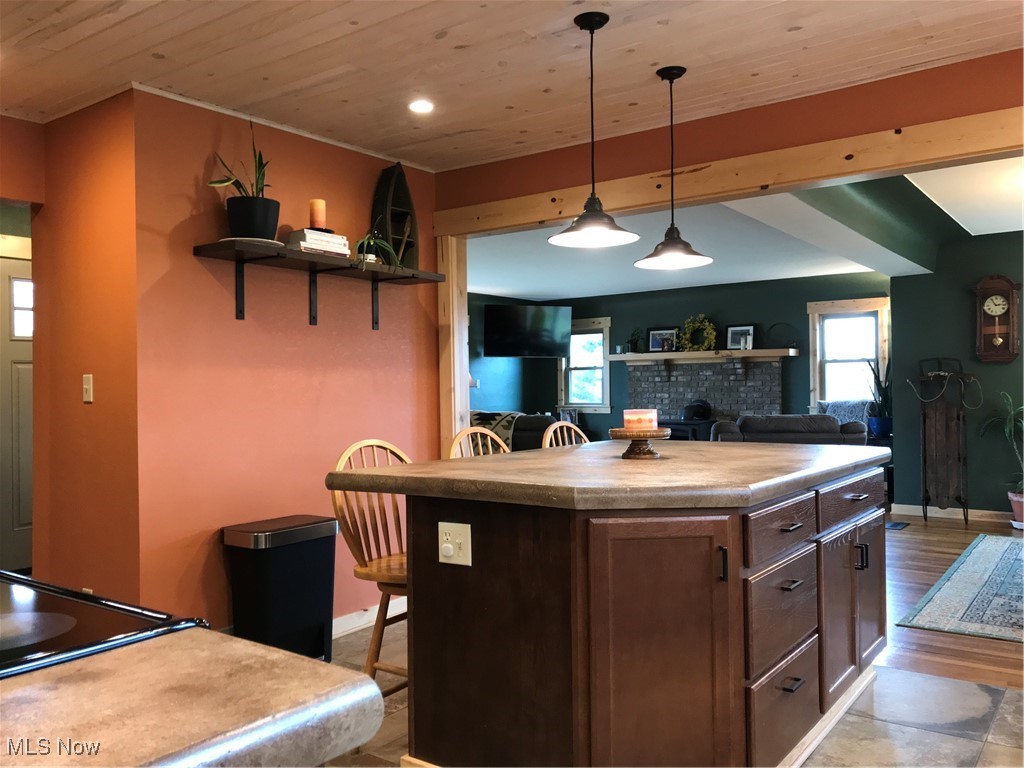8330 Knauf Road Canfield, OH 44406 - Photo 8 of 34 Kitchen with a breakfast bar area, wood ceiling, a center island, open shelves, and pendant lighting