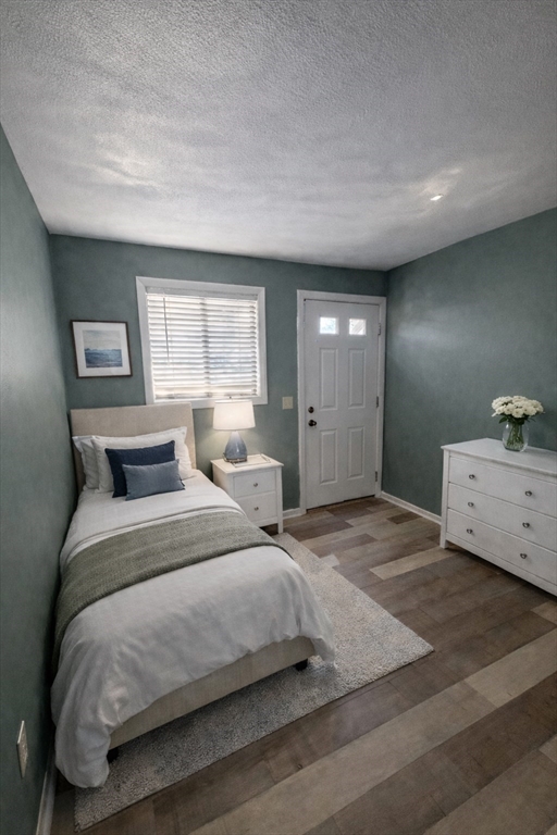 16 Cleveland Place, Unit 11 Gloucester, MA 01930 - Photo 5 of 8 a bedroom with a bed and window