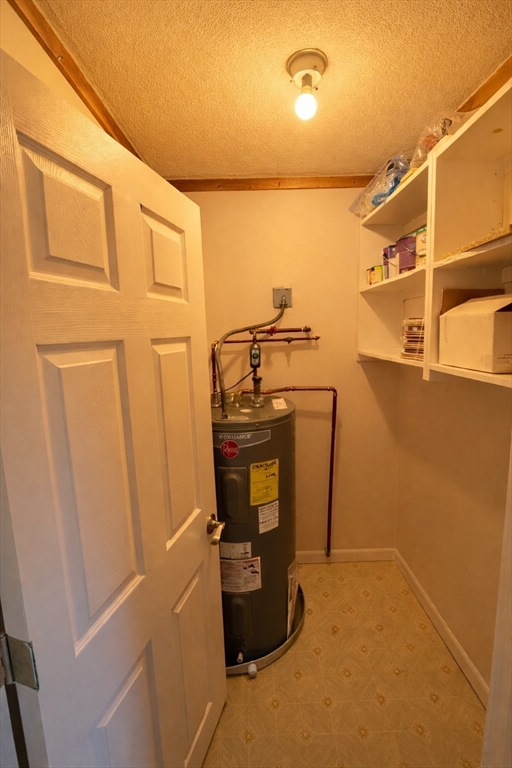 16 Cleveland Place, Unit 11 Gloucester, MA 01930 - Photo 7 of 8 a view of a storage & utility room with washer and dryer
