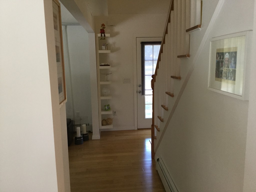 5 Bear Path Clinton, MA 01510 - Photo 15 of 30 a view of a hallway with wooden floor and a bathroom