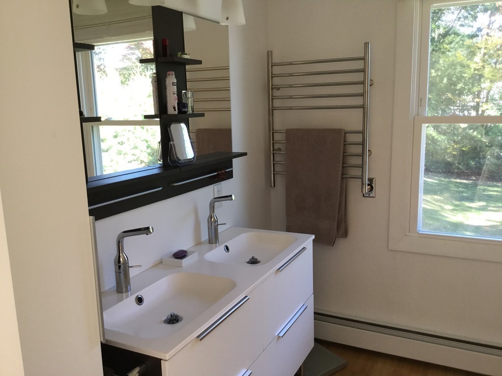 5 Bear Path Clinton, MA 01510 - Photo 21 of 30 a bathroom with a sink and a mirror