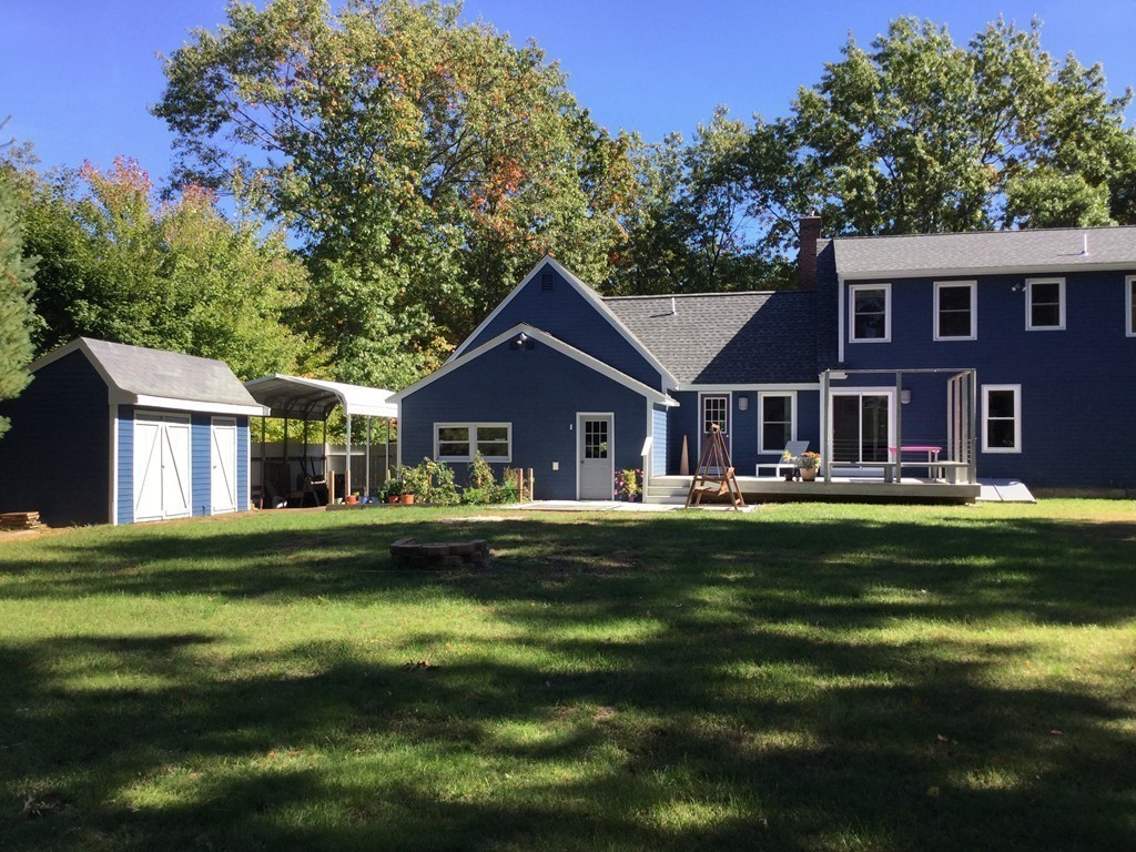 5 Bear Path Clinton, MA 01510 - Photo 26 of 30 a front view of a house with a garden