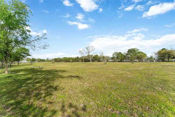 a view of an ocean and a yard