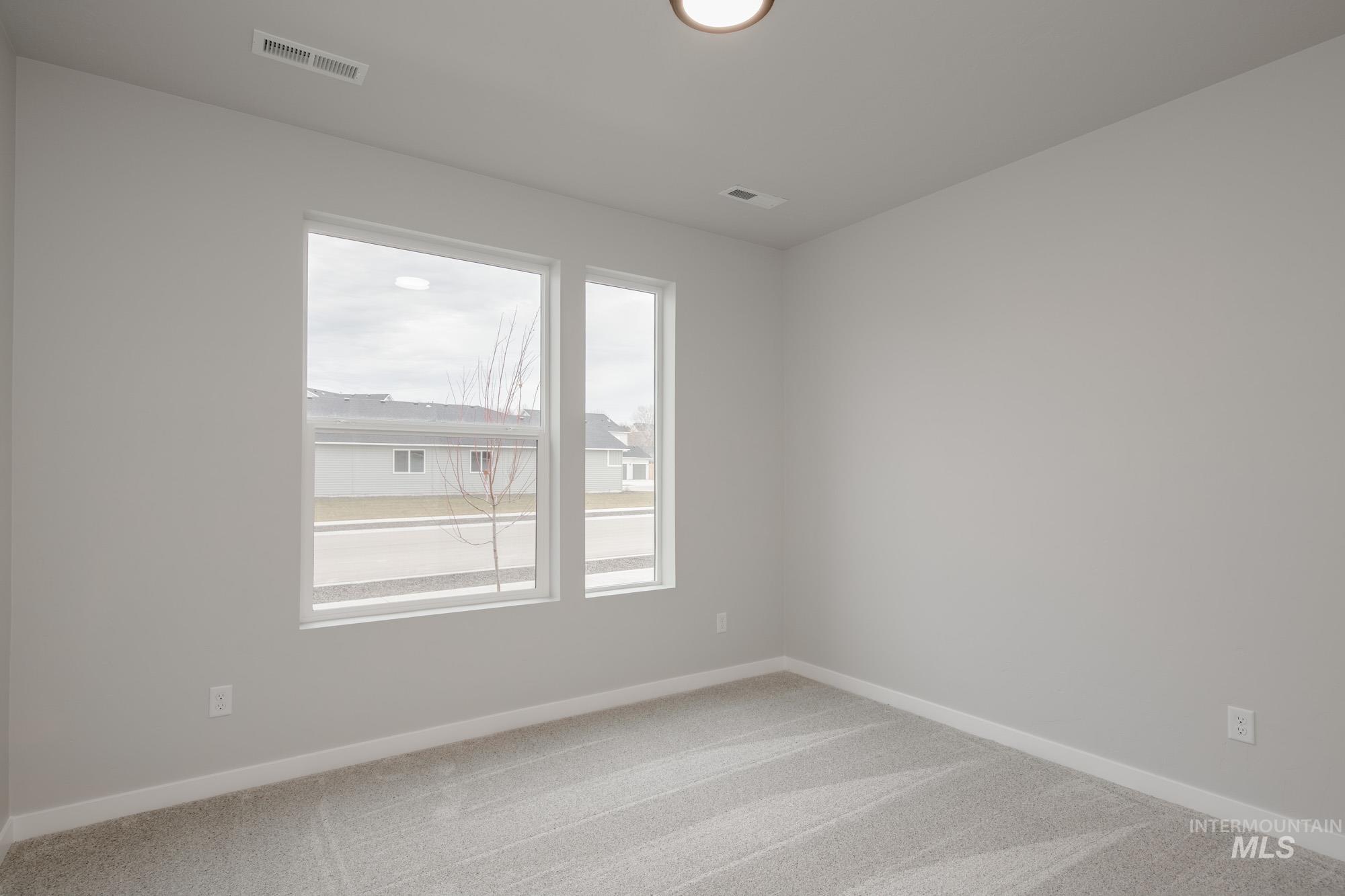 1631 Long Pond Street Middleton, ID 83644 - Photo 16 of 22 Carpeted empty room featuring baseboards