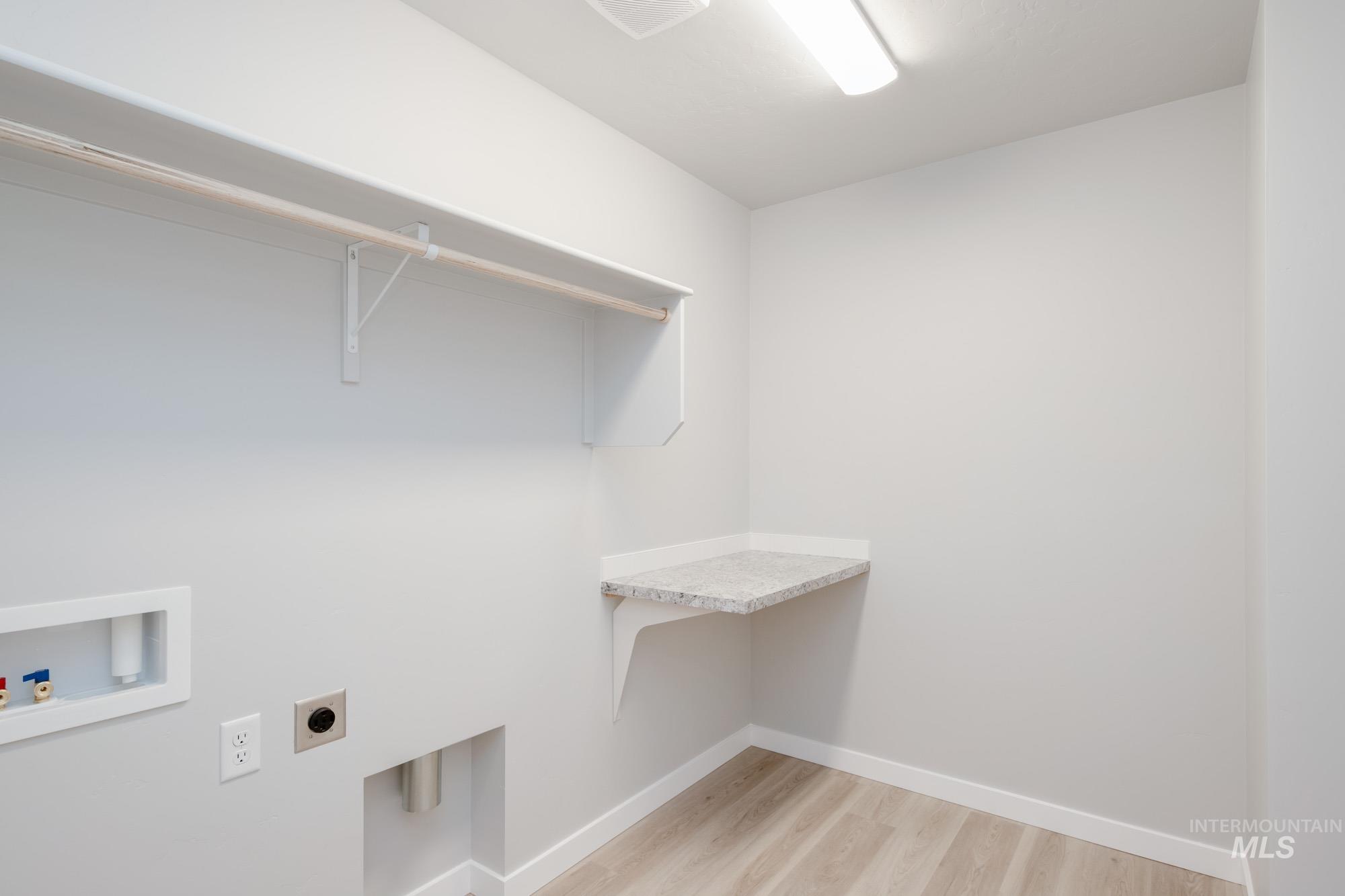 1631 Long Pond Street Middleton, ID 83644 - Photo 20 of 22 Laundry area featuring light wood finished floors, hookup for an electric dryer, and washer hookup