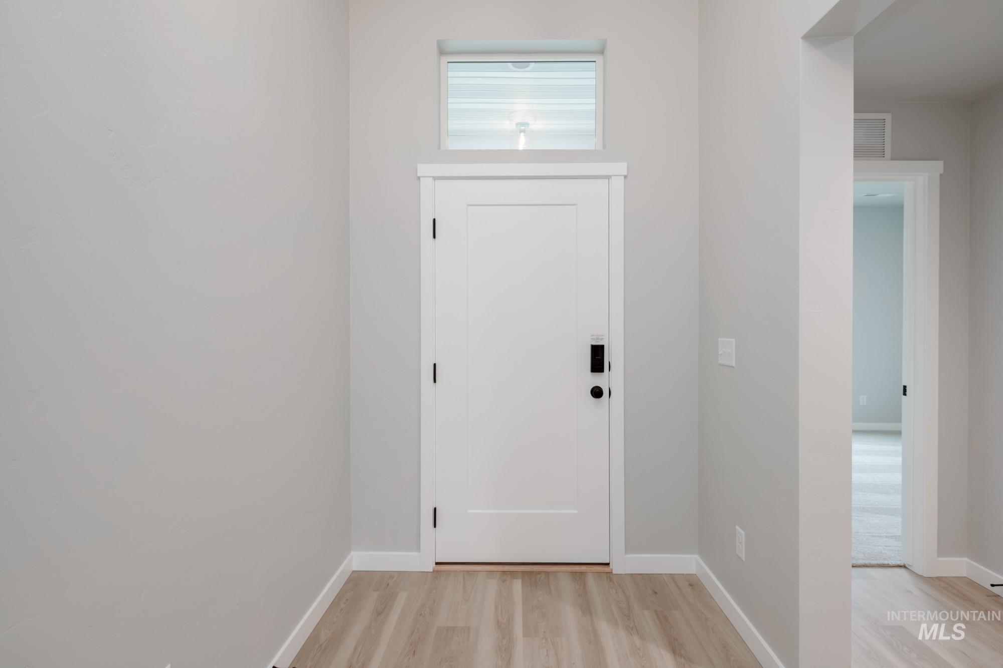 1631 Long Pond Street Middleton, ID 83644 - Photo 3 of 22 Entrance foyer featuring light wood finished floors and baseboards