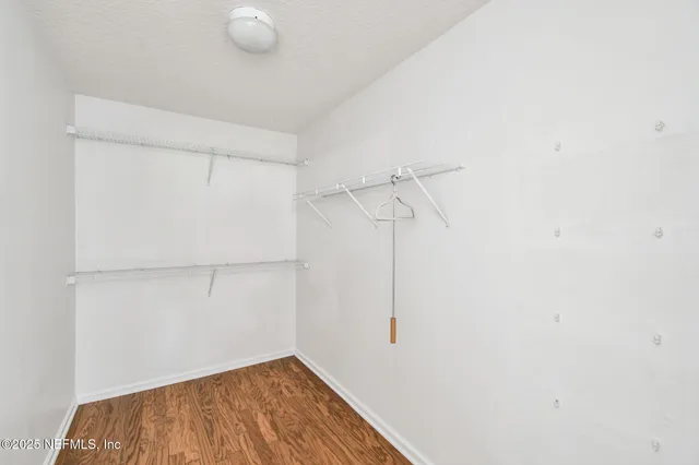 a view of a room with racks on the wall