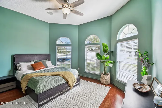 a bedroom with bed and a window