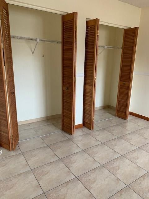 1950 Southwest 121st Court, Unit 240 Miami, FL 33175 - Photo 16 of 27 an empty room with staircase