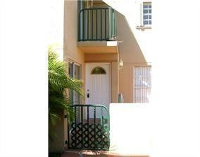 1950 Southwest 121st Court, Unit 240 Miami, FL 33175 - Photo 25 of 27 a view of a door of a house with a small yard