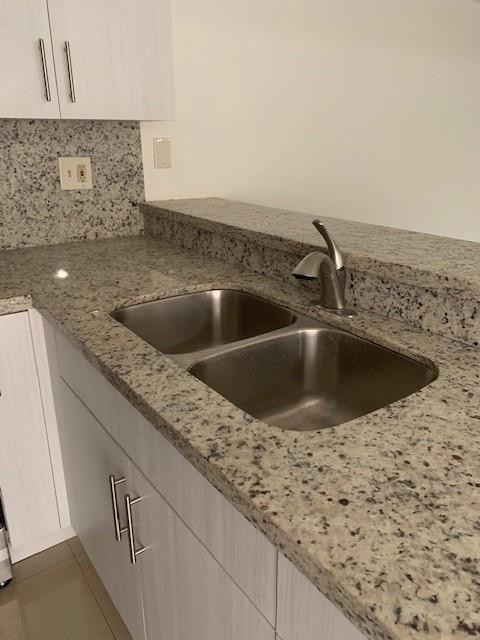 1950 Southwest 121st Court, Unit 240 Miami, FL 33175 - Photo 6 of 27 a kitchen with a sink and a window