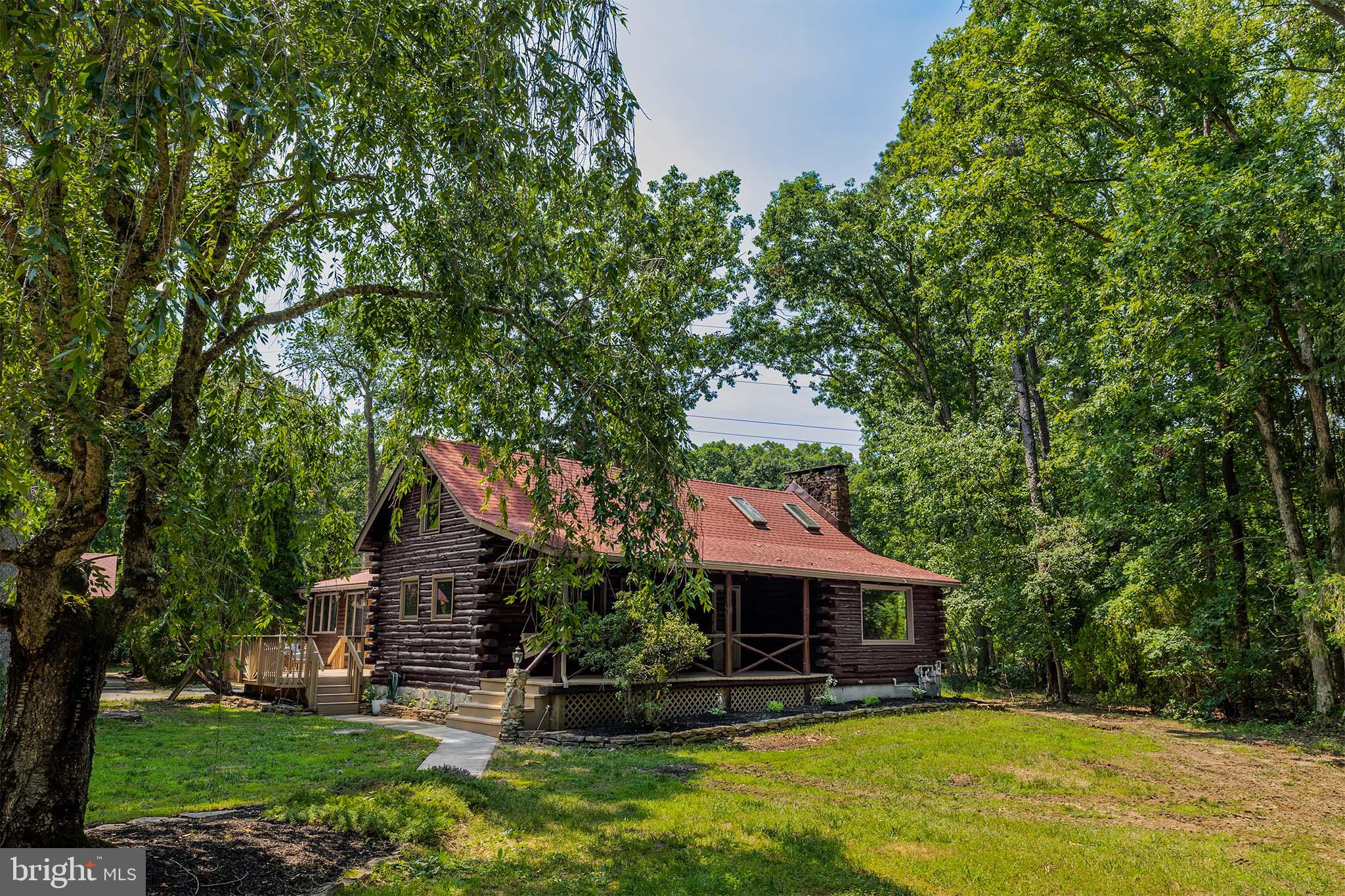 385 Upper Neck Road Pittsgrove, NJ 08318 - Photo 4 of 29 a front view of a house with garden