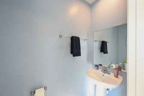 a bathroom with a sink and mirror