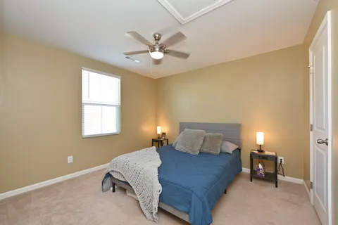 a bedroom with a bed and window