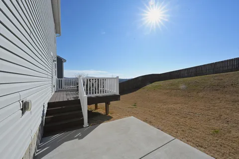 a view of balcony with furniture