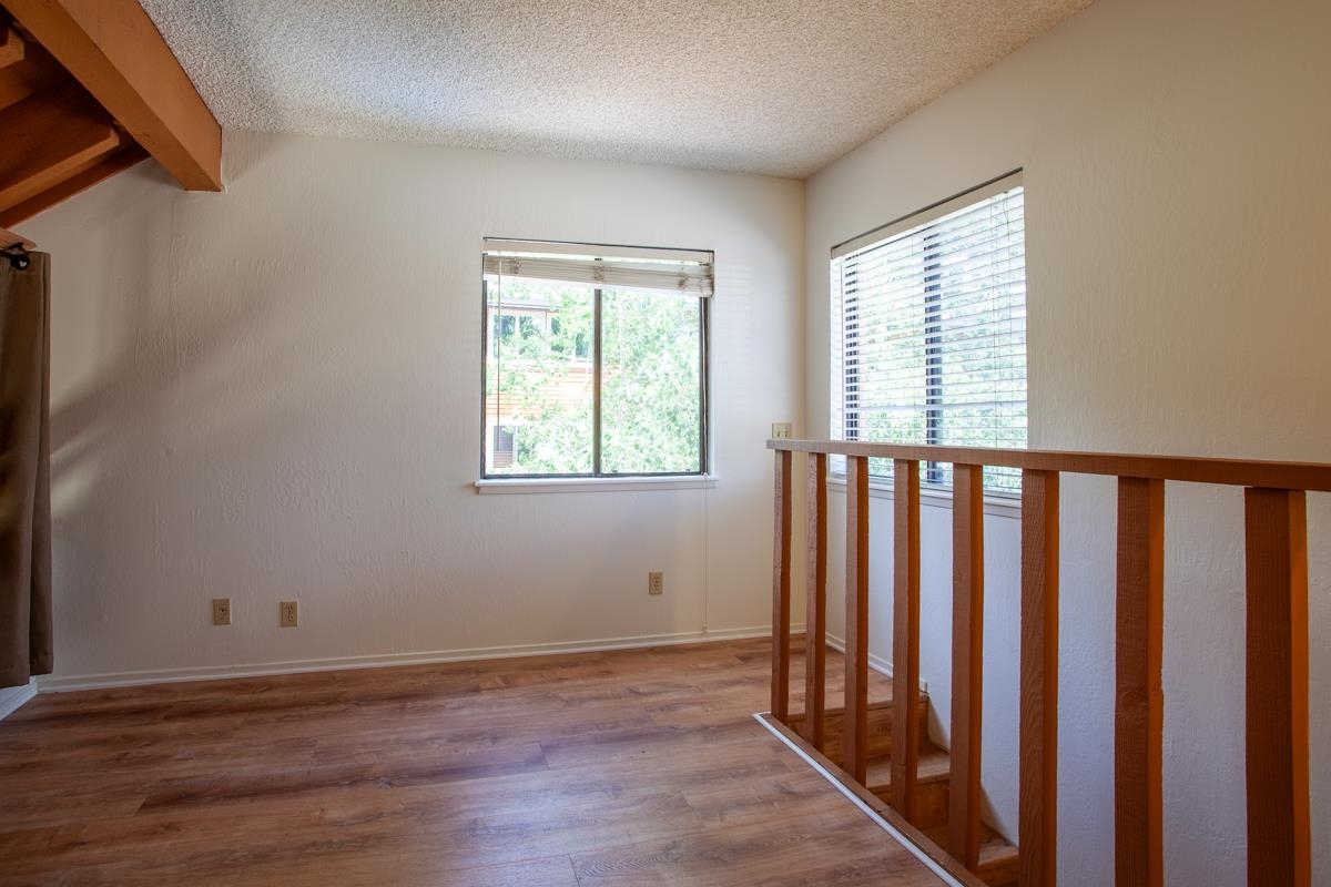 56 Davison Road, Unit 104 Mammoth Lakes, CA 93546 - Photo 14 of 22 a view of a room with wooden floor and windows