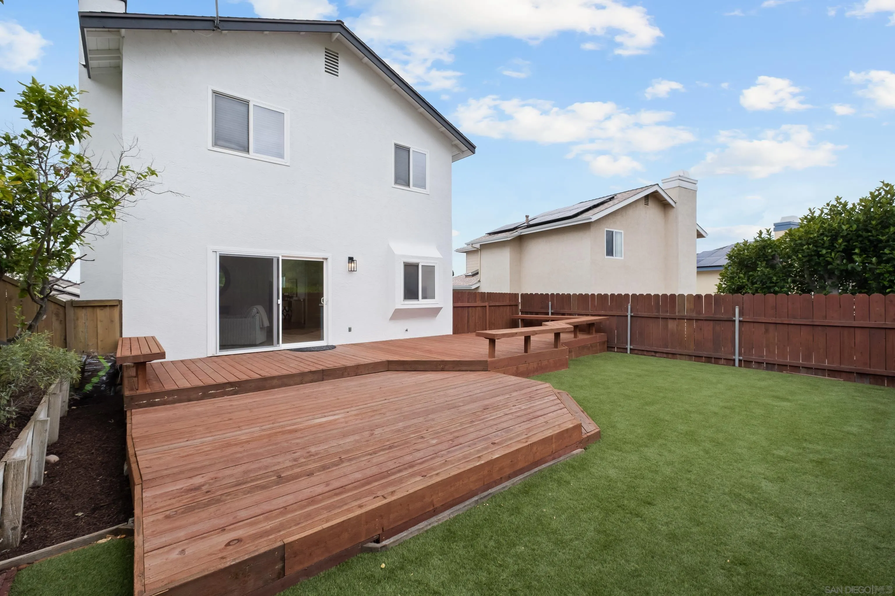 11478 Madera Rosa Way San Diego, CA 92124 - Photo 18 of 54 a view of a backyard with a garden