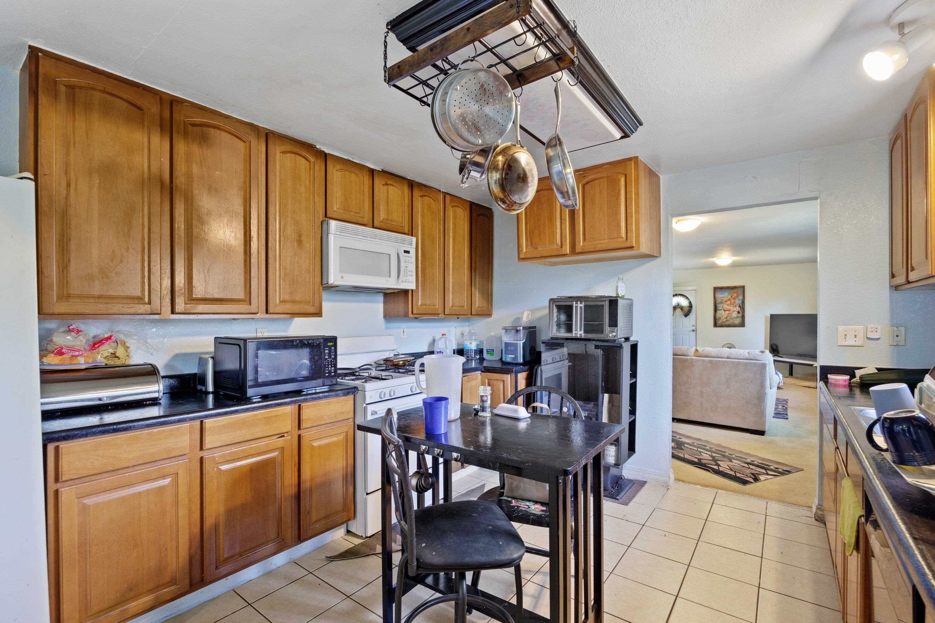 1220 5th Avenue Corning, CA 96021 - Photo 5 of 15 a view of a dining room with furniture and chandelier