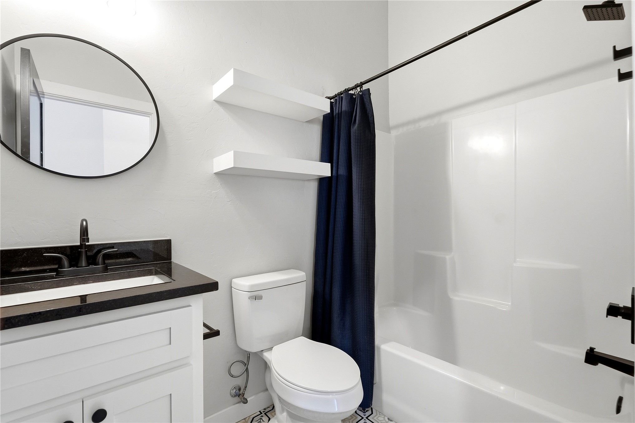 420942 East 1168 Road Eufaula, OK 74432 - Photo 31 of 43 White vanity with granite countertop, undermount sink, and matte black fixtures and tiled floors