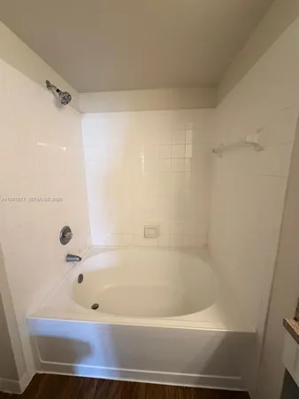 a bathroom with a sink and a large mirror