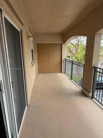 a view of empty room with floor to ceiling window