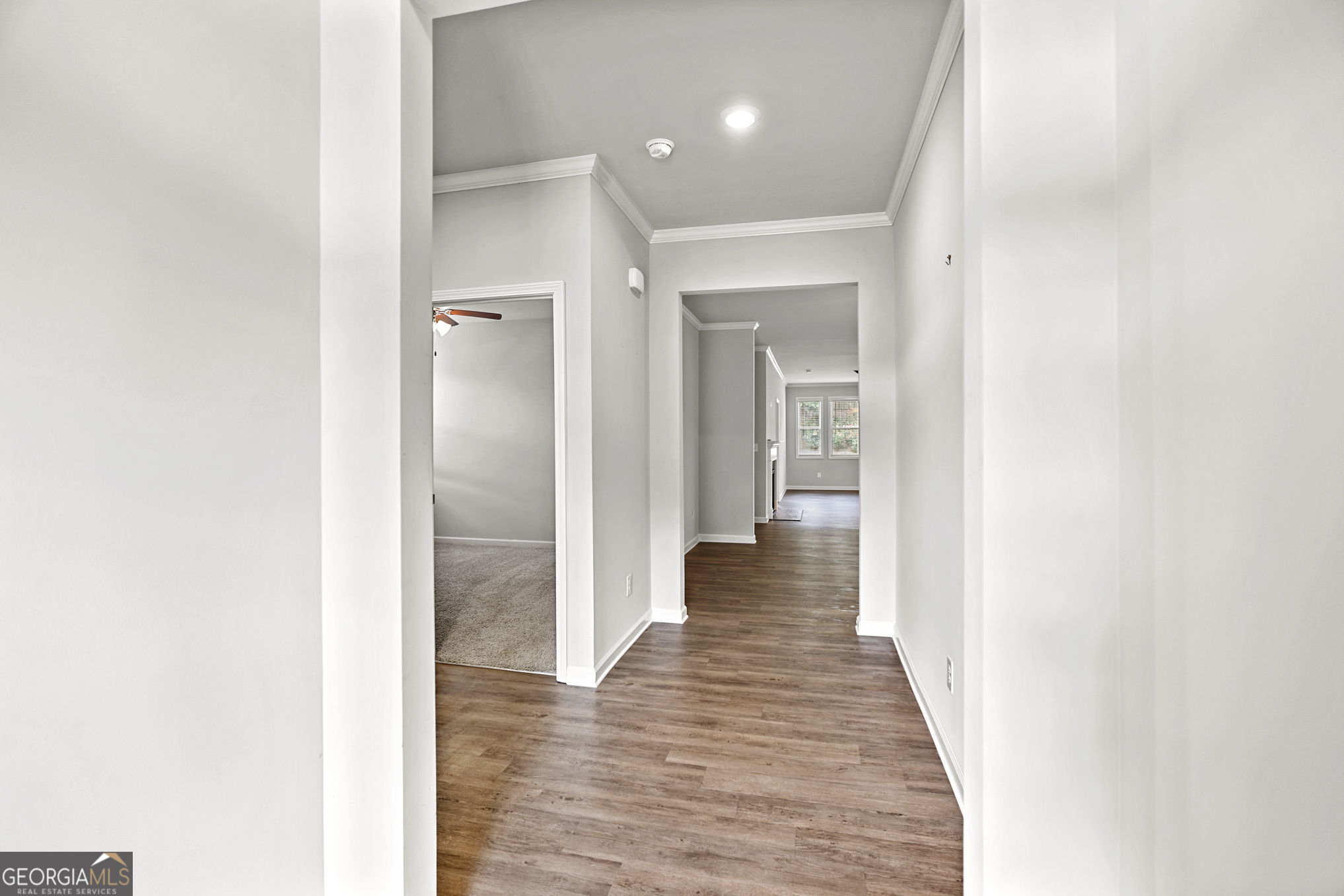 4605 Dandelion Way Cumming, GA 30040 - Photo 14 of 54 a view of a hallway with wooden floor