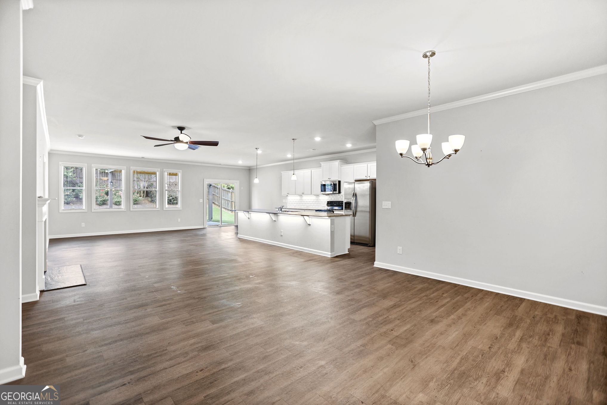 4605 Dandelion Way Cumming, GA 30040 - Photo 15 of 54 a view of a kitchen with wooden floor and a kitchen