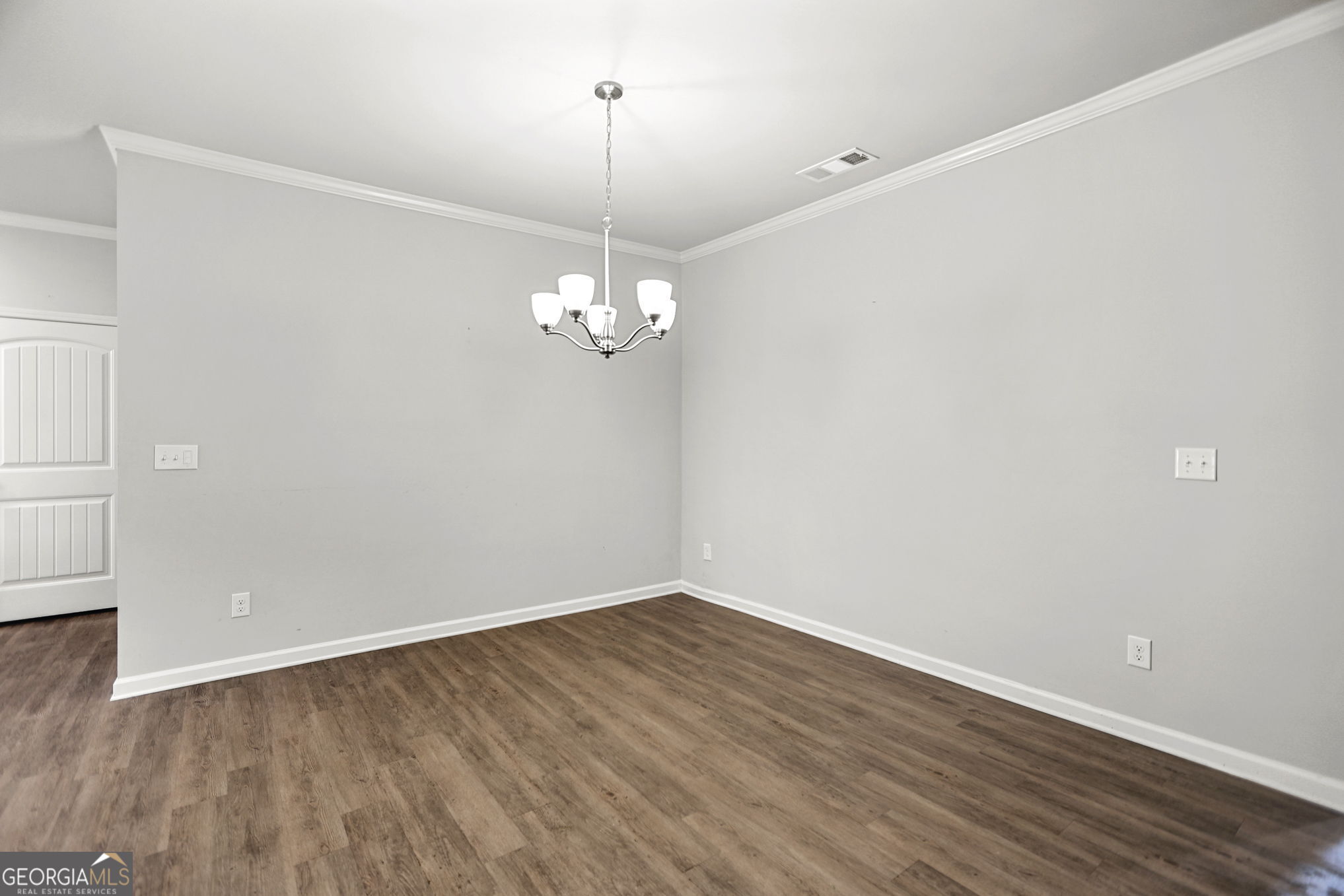 4605 Dandelion Way Cumming, GA 30040 - Photo 16 of 54 a view of empty room with wooden floor