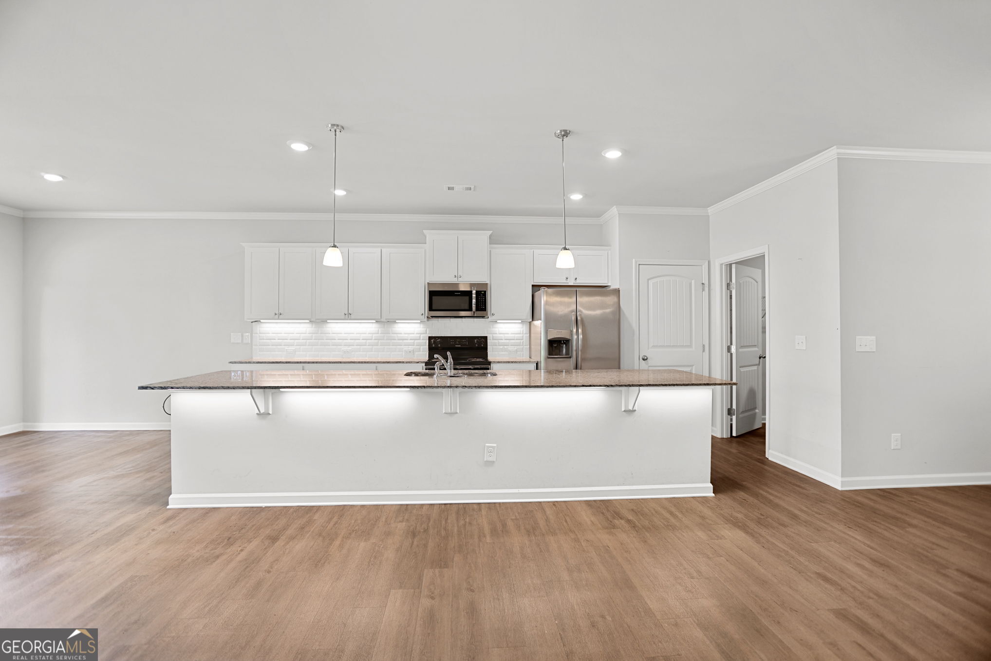 4605 Dandelion Way Cumming, GA 30040 - Photo 19 of 54 a view of kitchen with stainless steel appliances refrigerator sink and stove