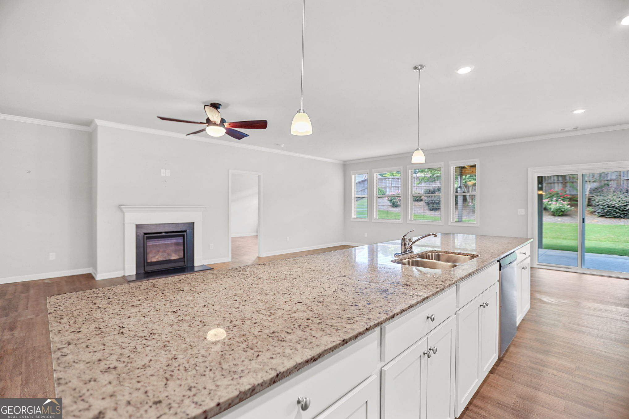 4605 Dandelion Way Cumming, GA 30040 - Photo 23 of 54 a kitchen with granite countertop a sink and a stove