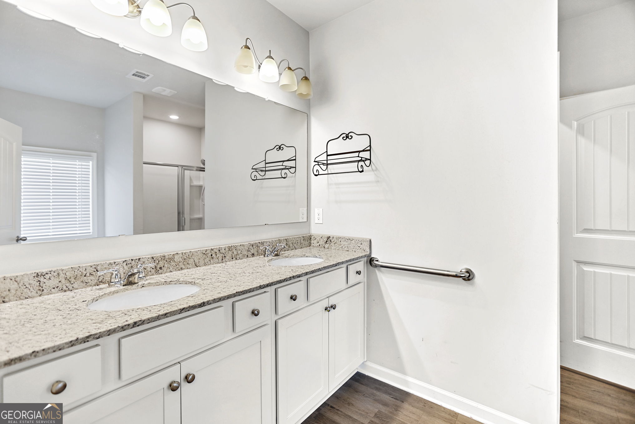 4605 Dandelion Way Cumming, GA 30040 - Photo 34 of 54 a bathroom with a granite countertop sink and a mirror