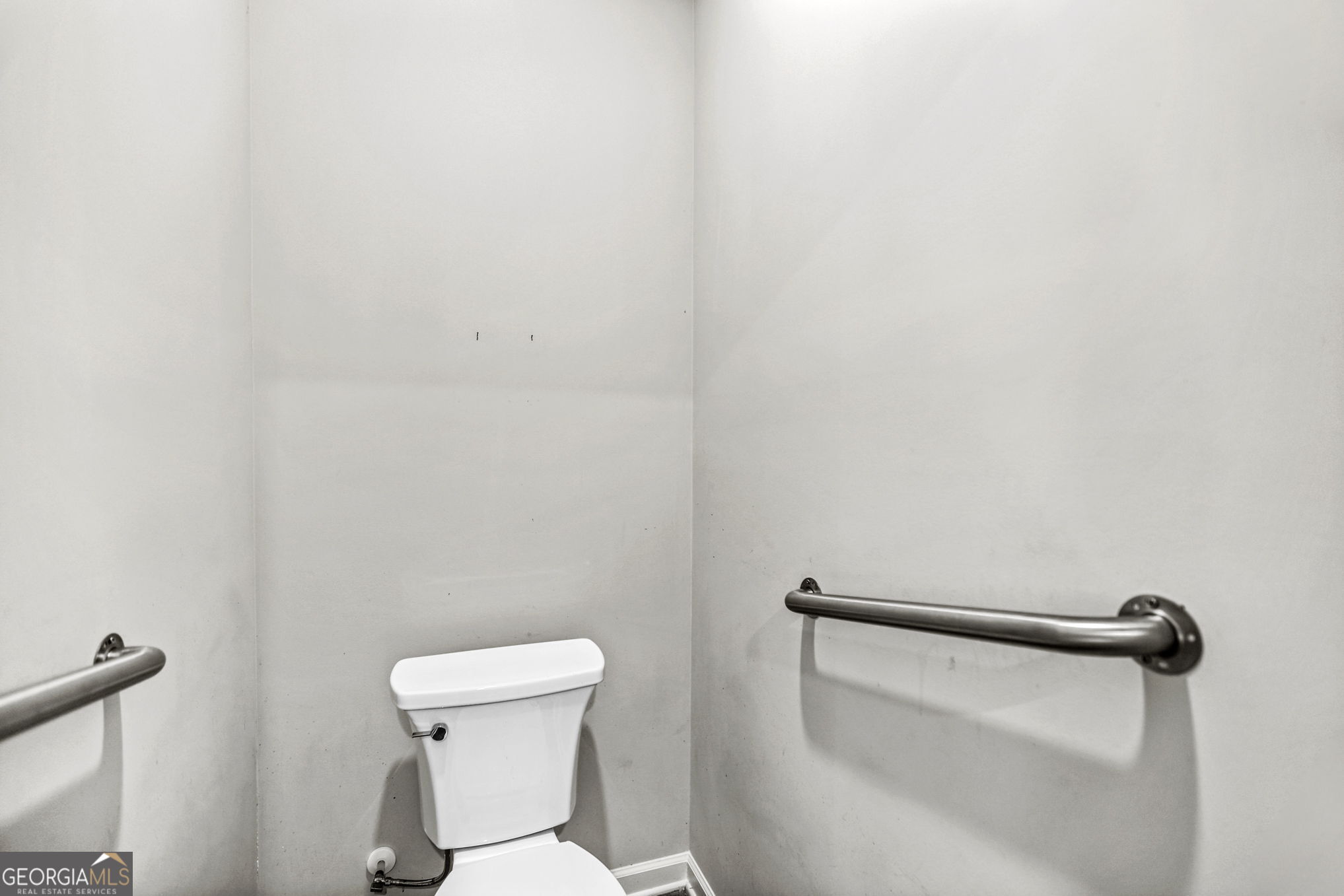 4605 Dandelion Way Cumming, GA 30040 - Photo 37 of 54 a bathroom with a toilet