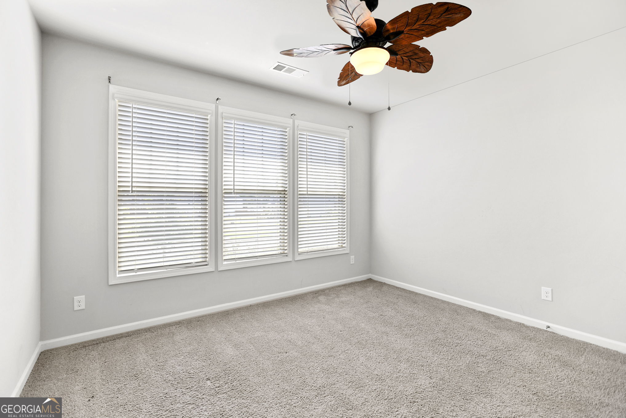 4605 Dandelion Way Cumming, GA 30040 - Photo 40 of 54 a view of an empty room with a window