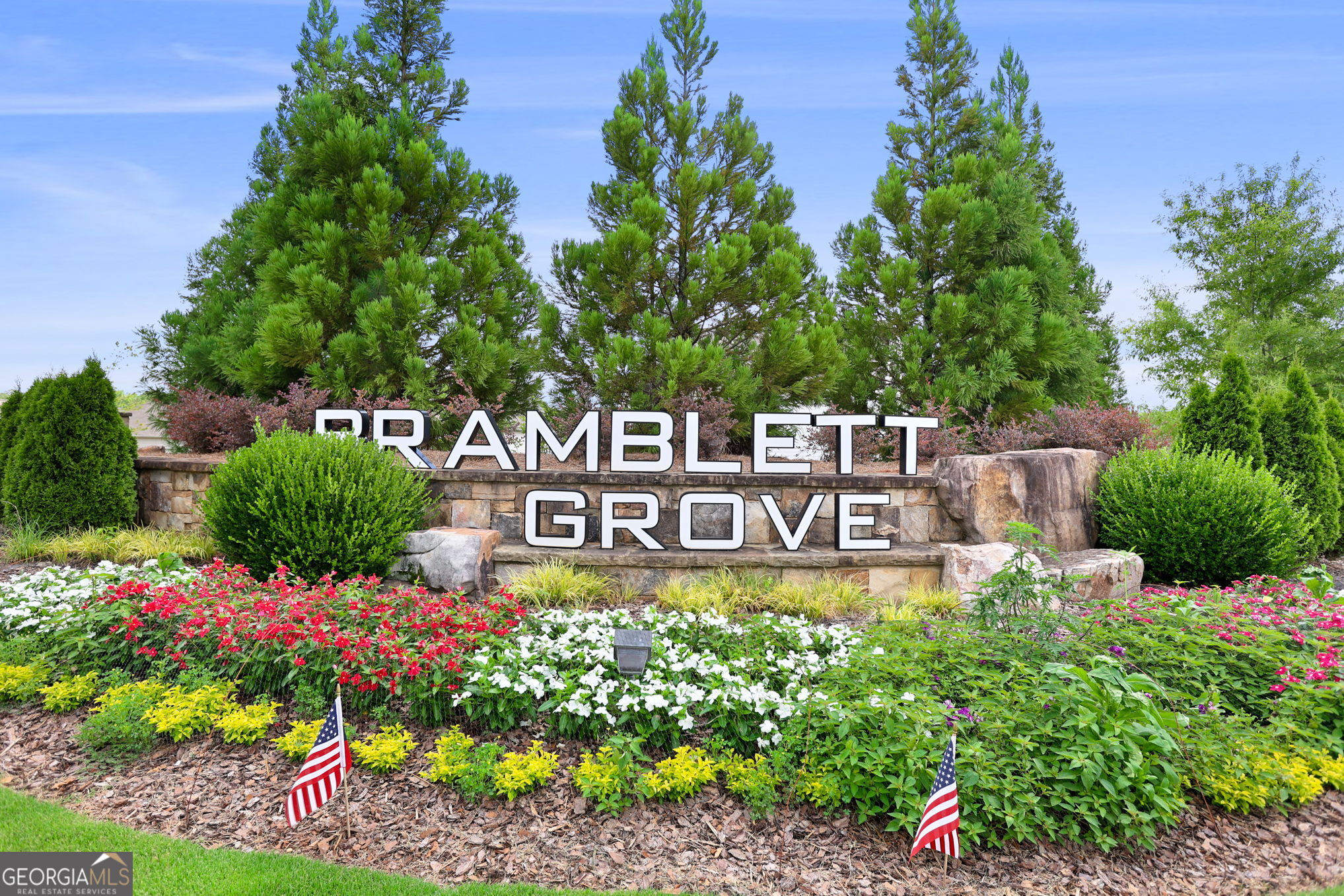 4605 Dandelion Way Cumming, GA 30040 - Photo 48 of 54 a street sign that is in front of flowers