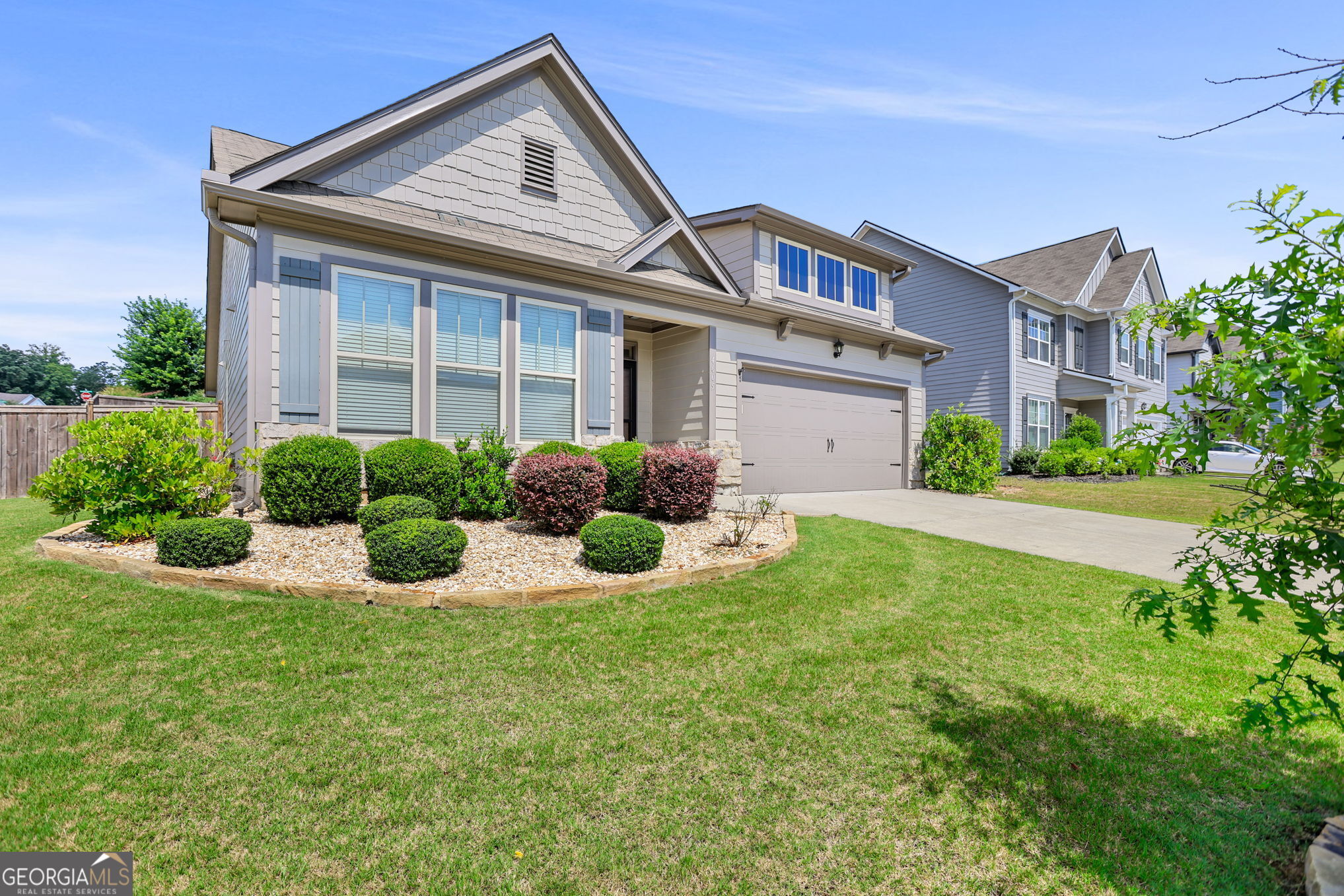 4605 Dandelion Way Cumming, GA 30040 - Photo 5 of 54 a front view of a house with a yard and plants