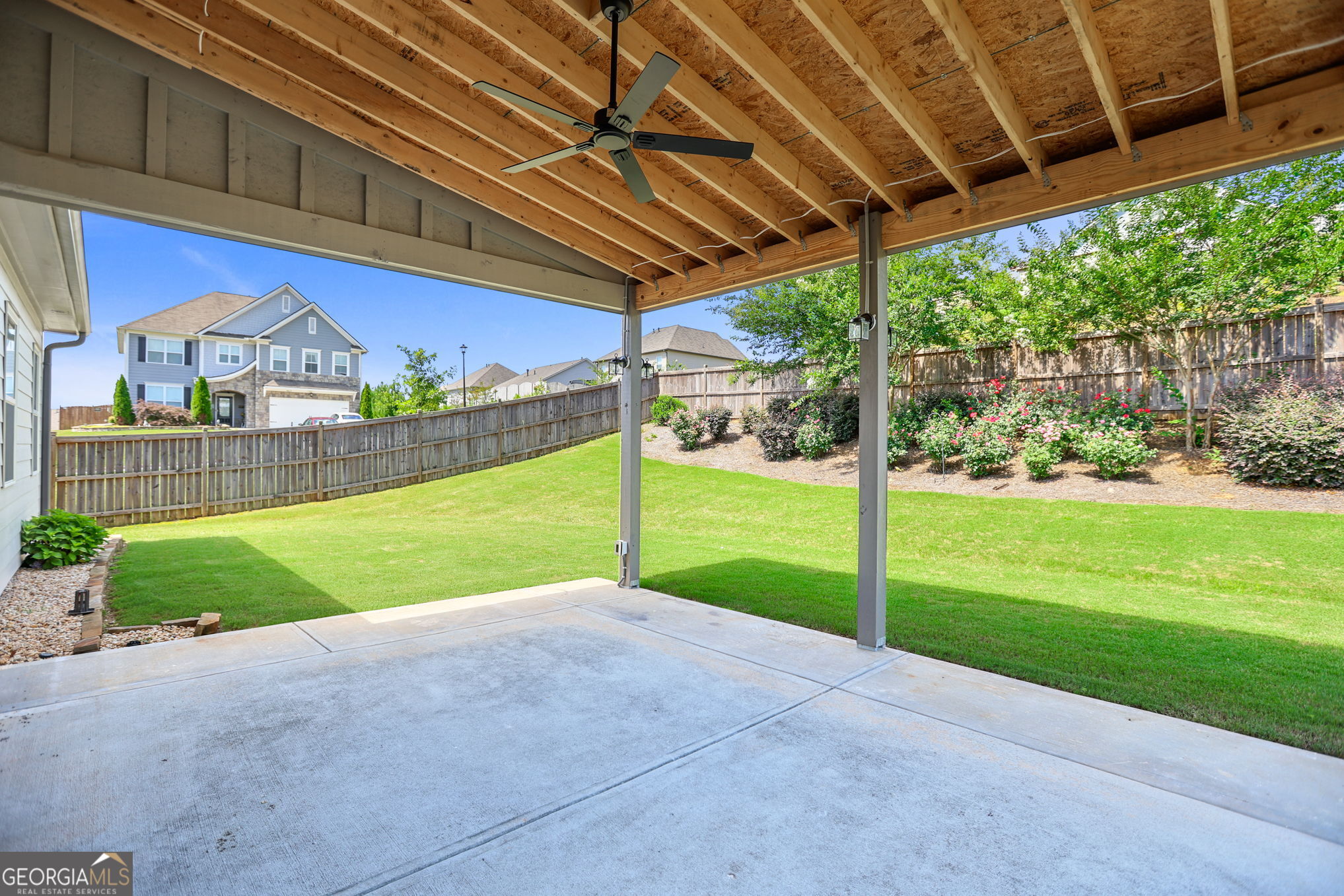 4605 Dandelion Way Cumming, GA 30040 - Photo 8 of 54 a view of a backyard with a garden and plants