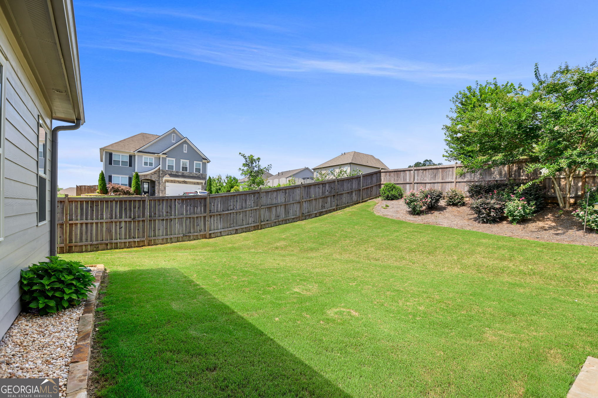 4605 Dandelion Way Cumming, GA 30040 - Photo 9 of 54 a view of a backyard