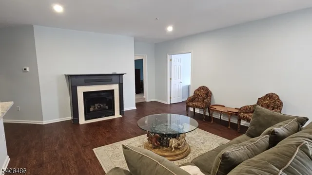 a living room with furniture a fireplace and a fireplace