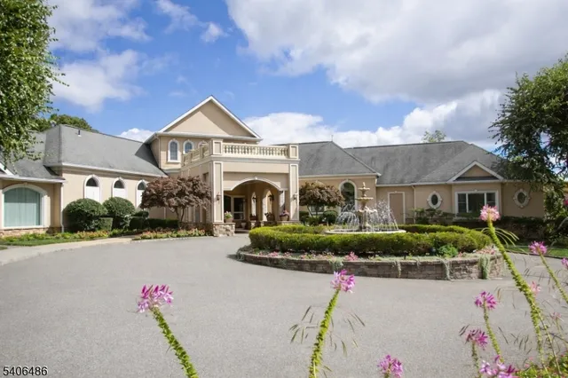 a house with lots of trees in the background