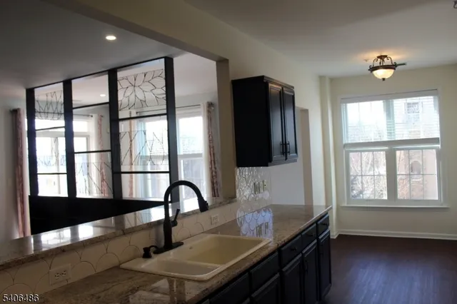 a view of a workspace window and wooden floor