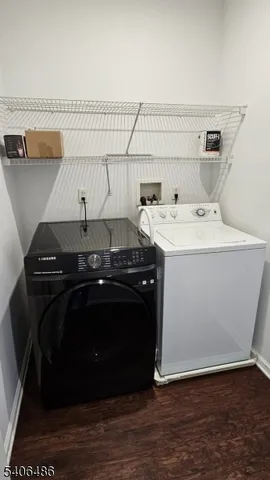 a utility room with a sink and a stove top oven