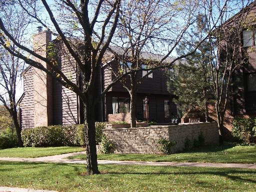 1158 Meadow Road, Unit 1 Northbrook, IL 60062 - Photo 1 of 1 a front view of a house with garden