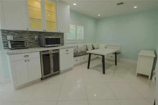 a kitchen with a sink stove and refrigerator