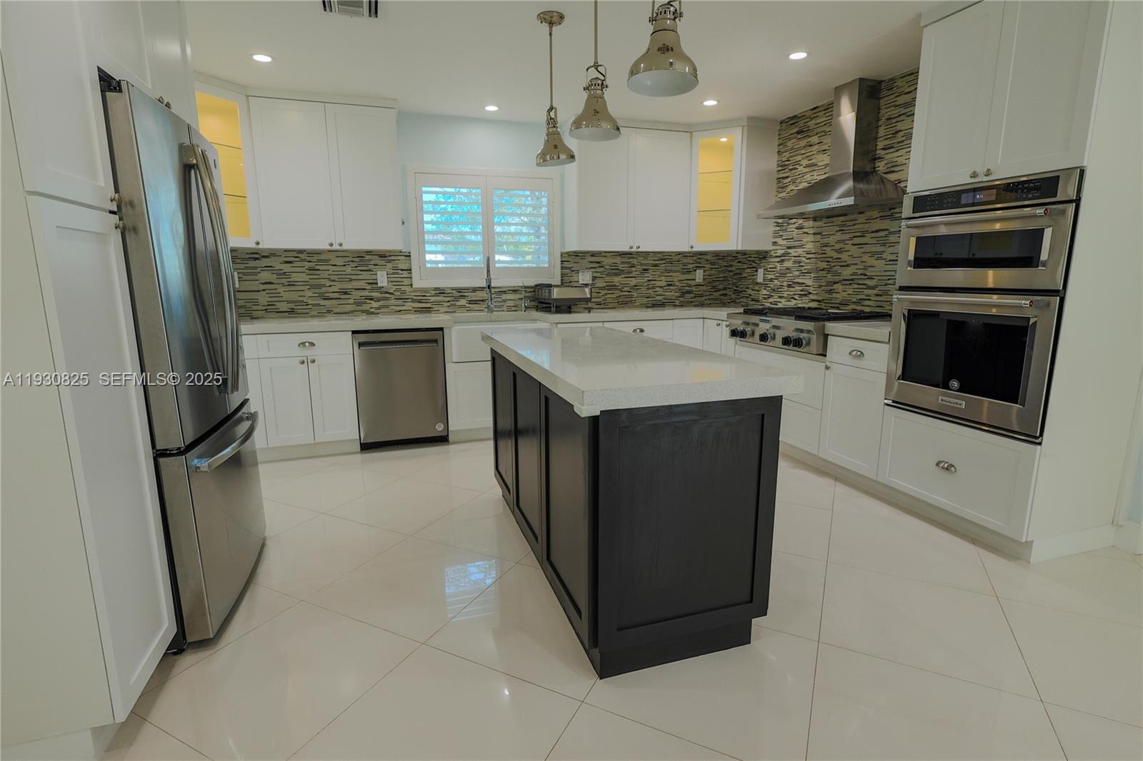 9870 Southwest 96th Street Miami, FL 33176 - Photo 13 of 13 a kitchen with a sink stove and refrigerator